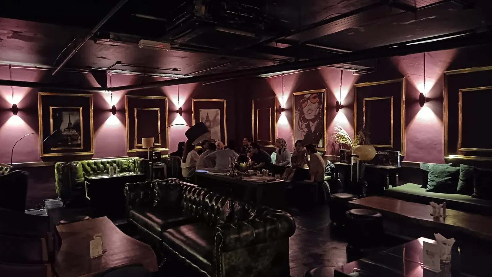 LandOn’s leather seating, plum walls and framed artwork